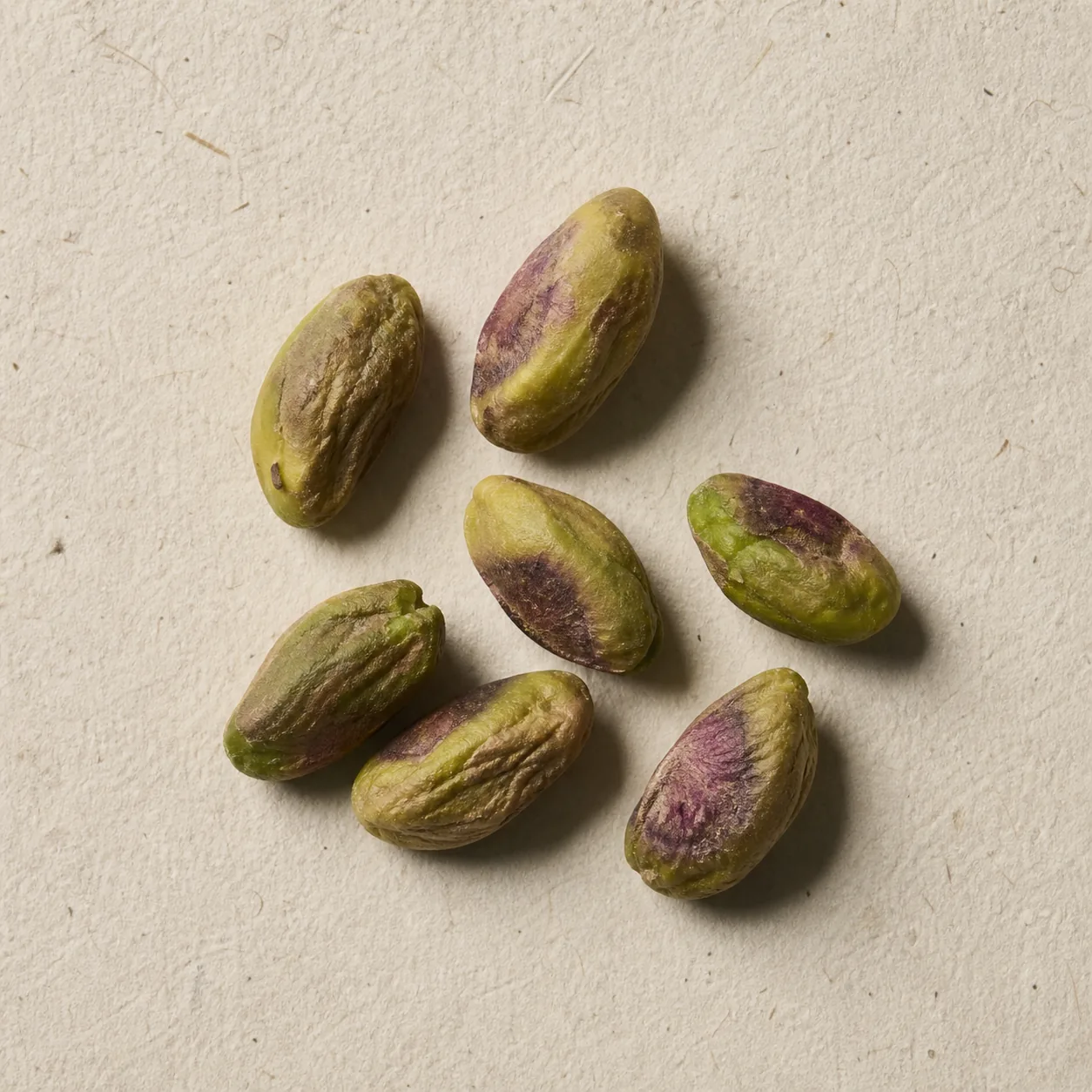 Shelled pistachio kernels on unbleached paper